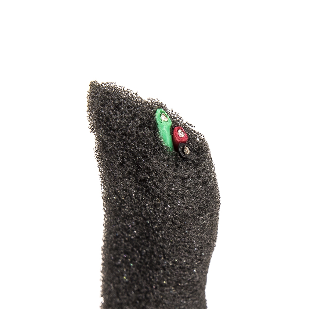 Foam cable wrap tip with bare red and green wire ends